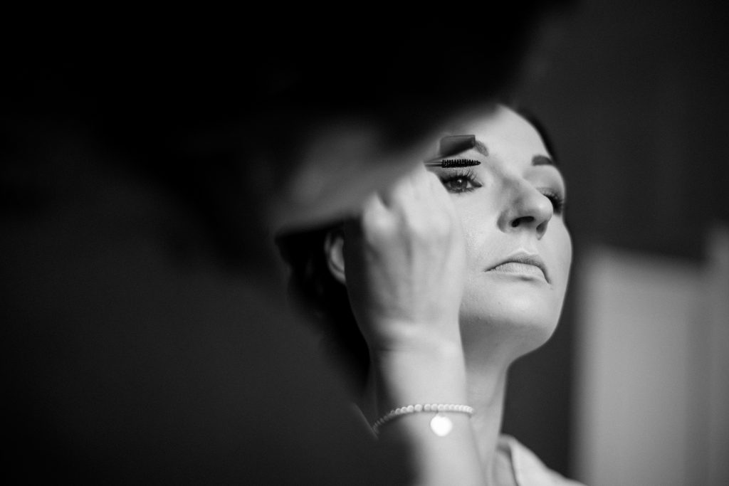 MUA Elmore court applying make up to bride