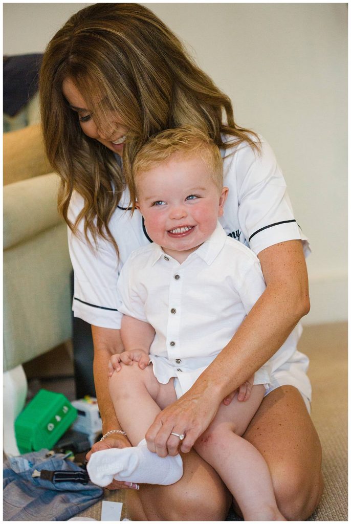 little boy laughing wedding day Barnsley house cotswold photographer